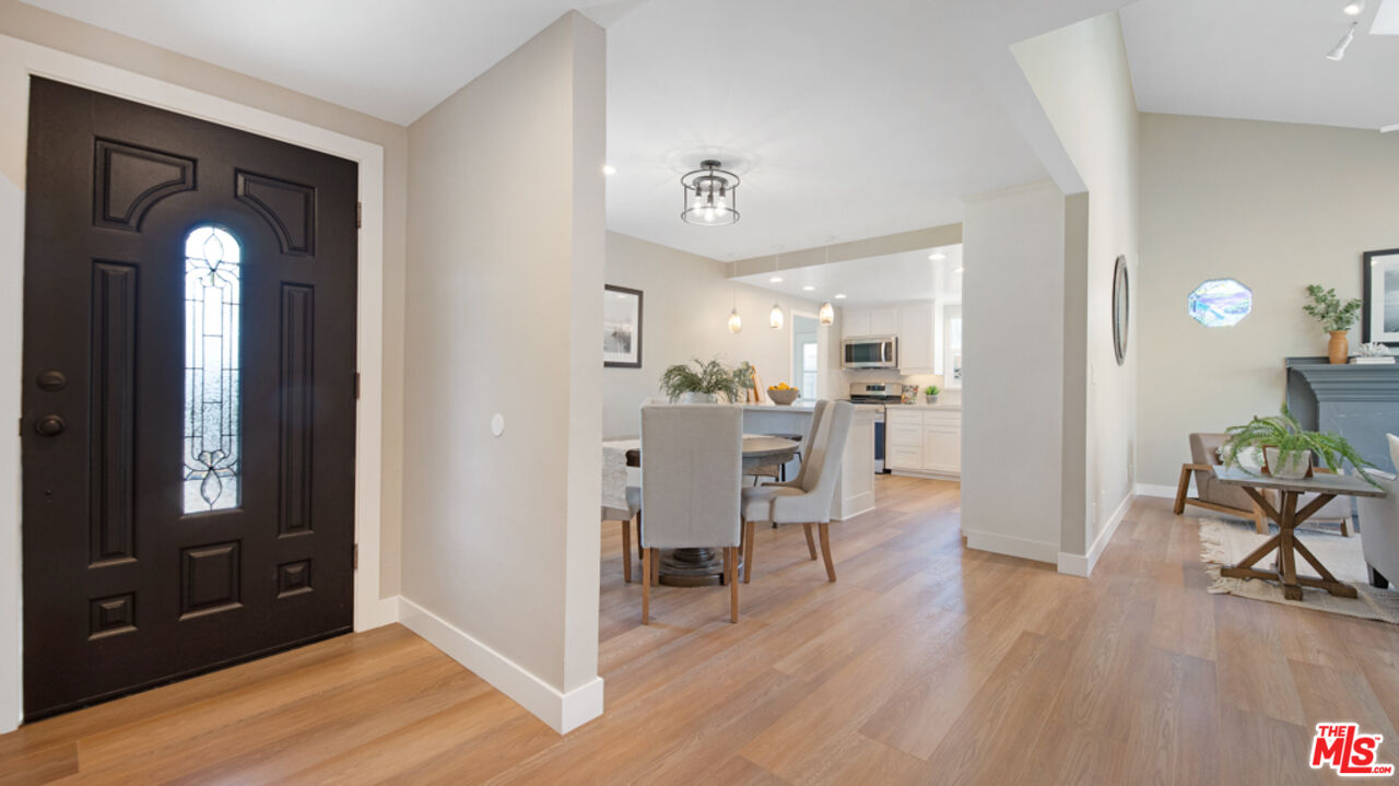 5601 Middlecoff Drive Huntington Beach, CA 92649 - Photo 23 of 49 a view of a dining room with furniture and wooden floor