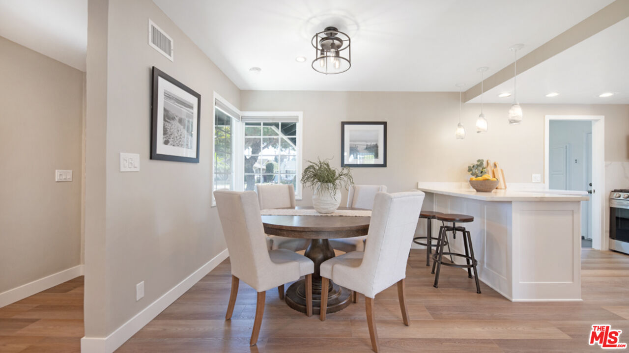 5601 Middlecoff Drive Huntington Beach, CA 92649 - Photo 25 of 49 a view of a dining room with furniture and a chandelier