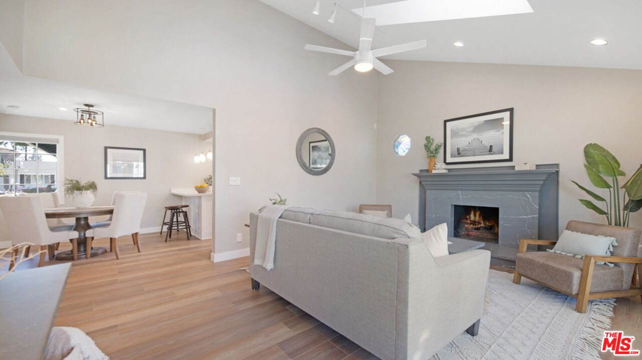 5601 Middlecoff Drive Huntington Beach, CA 92649 - Photo 31 of 49 a living room with furniture and a fireplace