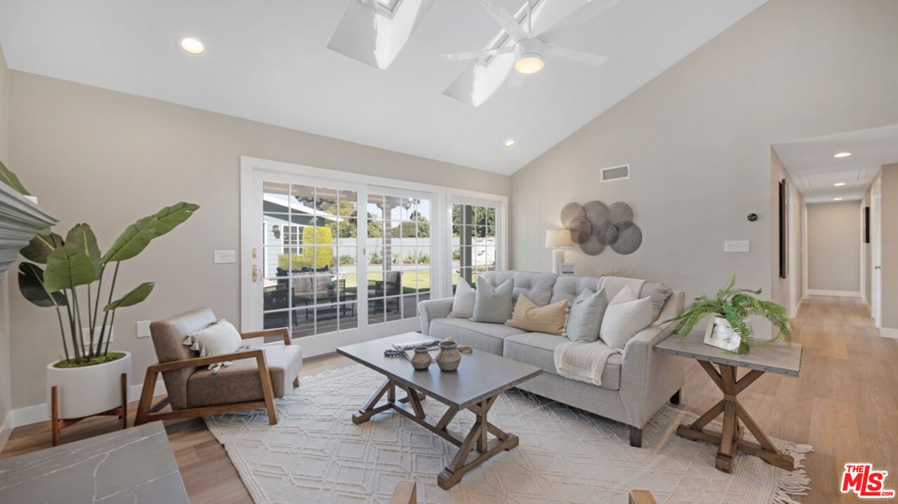 5601 Middlecoff Drive Huntington Beach, CA 92649 - Photo 32 of 49 a living room with furniture and a large window