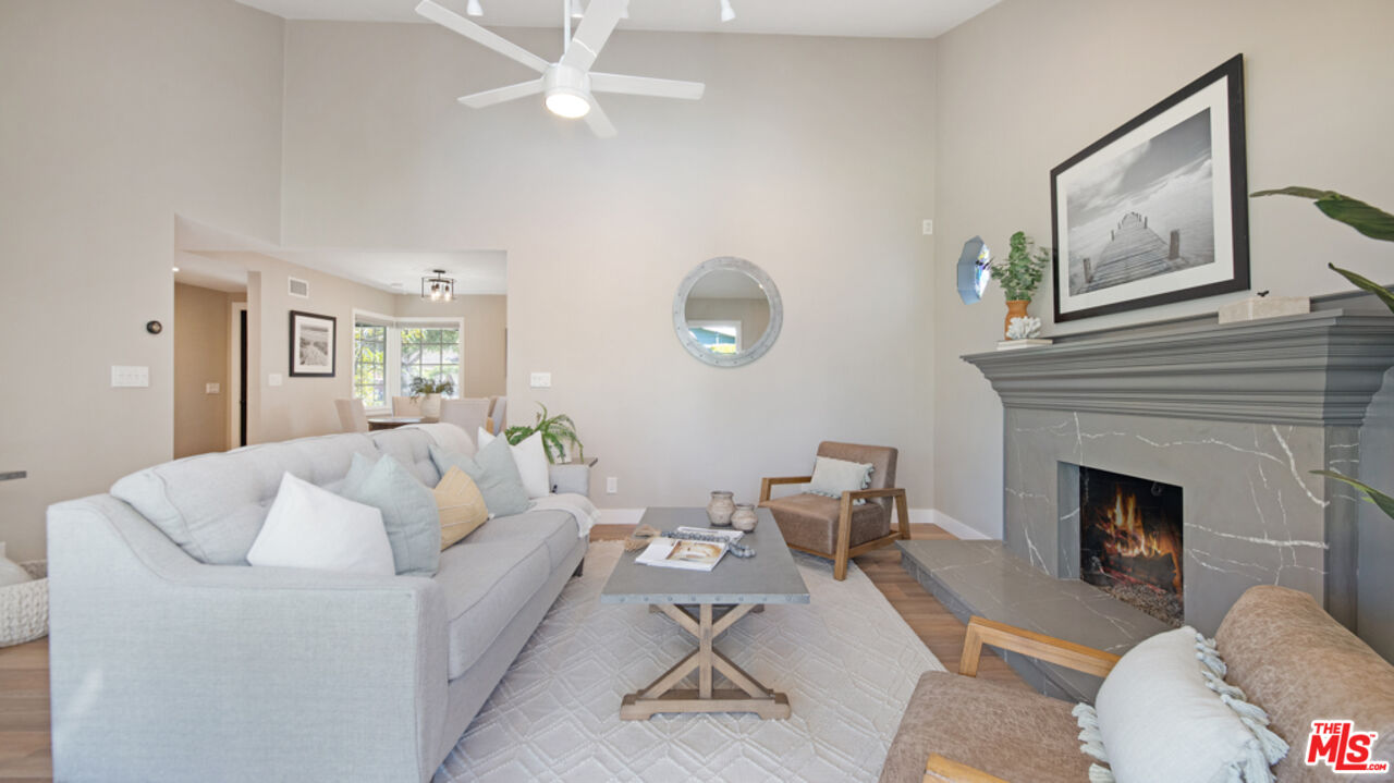 5601 Middlecoff Drive Huntington Beach, CA 92649 - Photo 34 of 49 a living room with furniture and a fireplace
