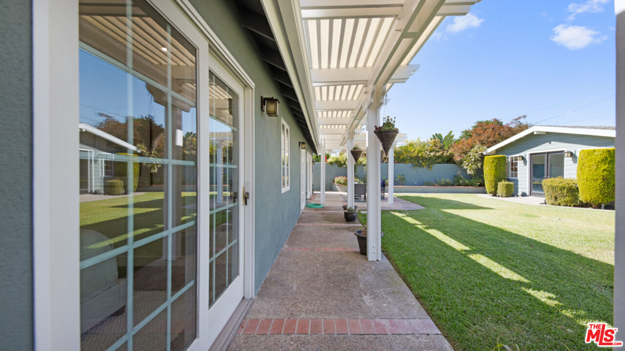 5601 Middlecoff Drive Huntington Beach, CA 92649 - Photo 38 of 49 a view of house with a big yard and potted plants