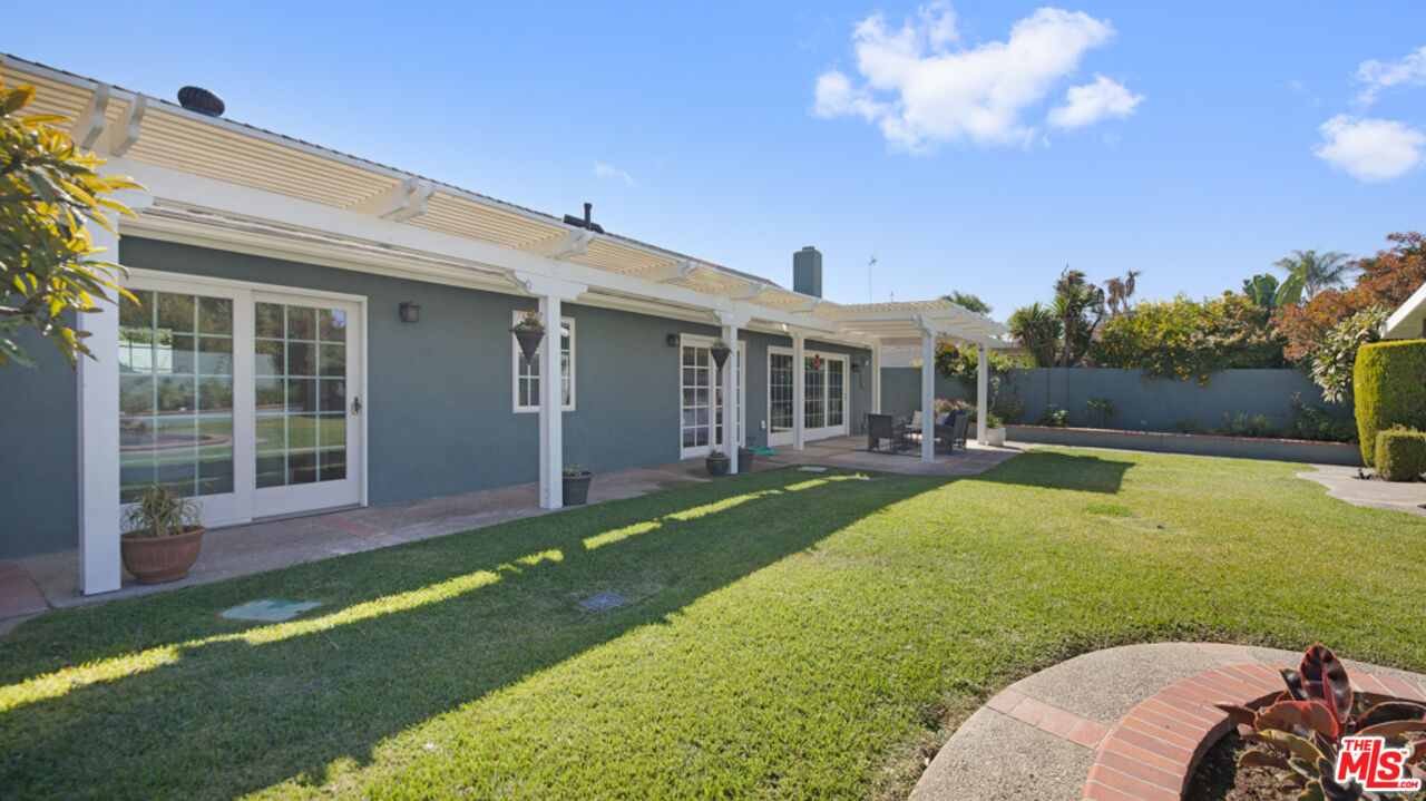 5601 Middlecoff Drive Huntington Beach, CA 92649 - Photo 39 of 49 a view of a house with a backyard porch and sitting area