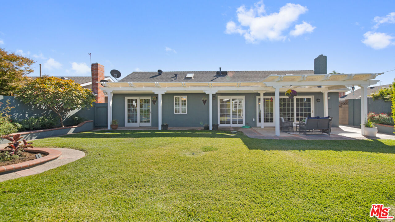 5601 Middlecoff Drive Huntington Beach, CA 92649 - Photo 40 of 49 a front view of a house with swimming pool having outdoor seating