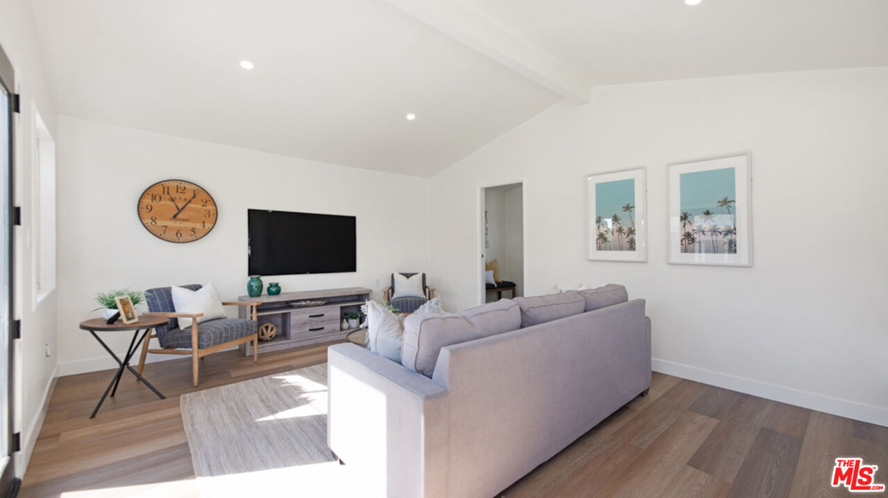 5601 Middlecoff Drive Huntington Beach, CA 92649 - Photo 42 of 49 a living room with furniture and a flat screen tv