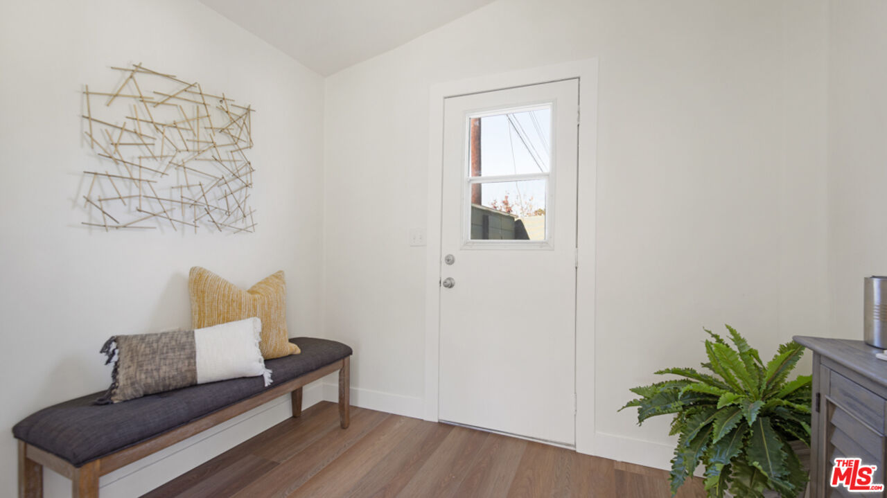 5601 Middlecoff Drive Huntington Beach, CA 92649 - Photo 44 of 49 a living room with furniture and a potted plant