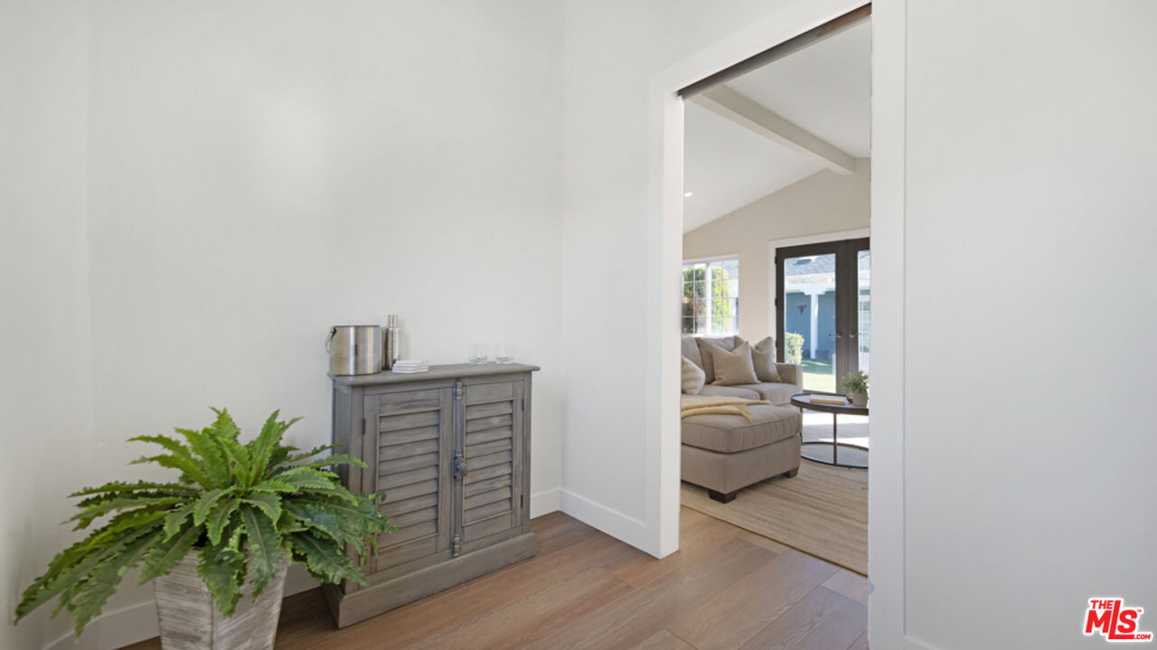 5601 Middlecoff Drive Huntington Beach, CA 92649 - Photo 45 of 49 a hallway with a potted plant and a window
