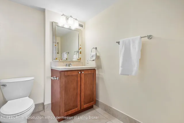 a view of a hallway with a chandelier and entryway