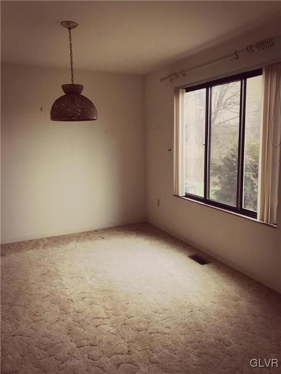 1201 Butztown Road, Unit 14 Bethlehem, PA 18017 - Photo 7 of 13 a view of an empty room with a window