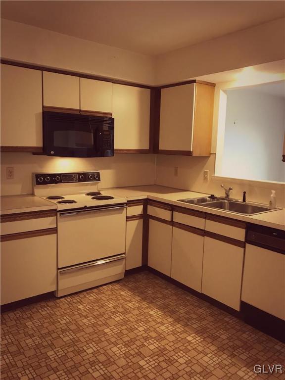 1201 Butztown Road, Unit 14 Bethlehem, PA 18017 - Photo 10 of 13 a kitchen with sink cabinets and appliances