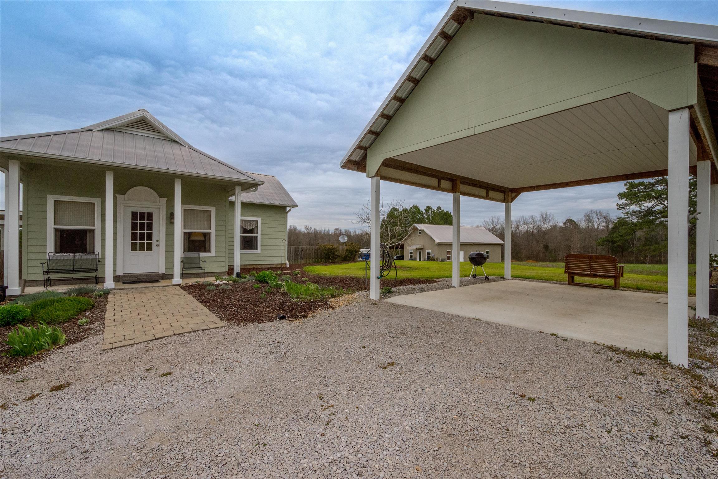 601 Vinta Mill Road West Prospect, TN 38477 - Photo 2 of 30 a view of a house with porch and garden