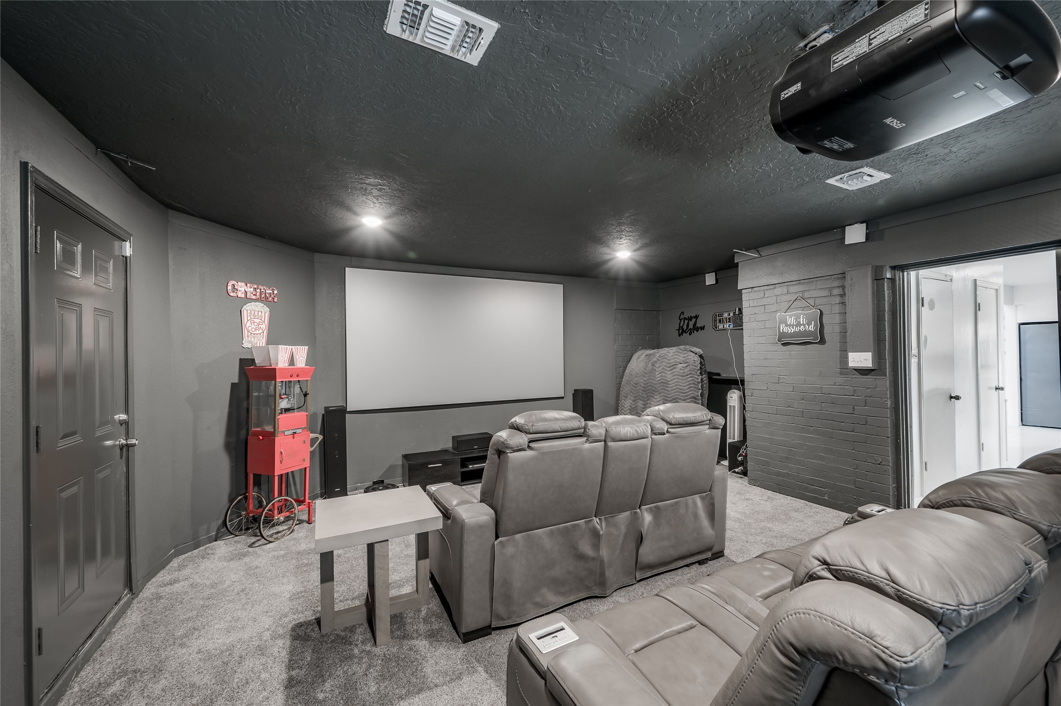 611 Montclair Boulevard Sugar Land, TX 77478 - Photo 33 of 50 The dedicated media room enhances your home’s entertainment options, offering a private, high-tech retreat where you can enjoy cinematic experiences from the comfort of home.