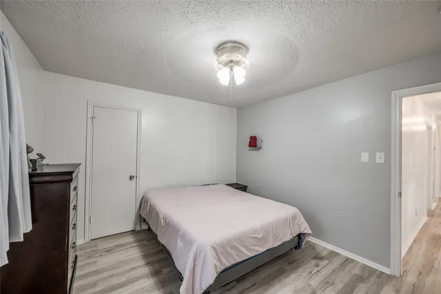a bedroom with bed and window