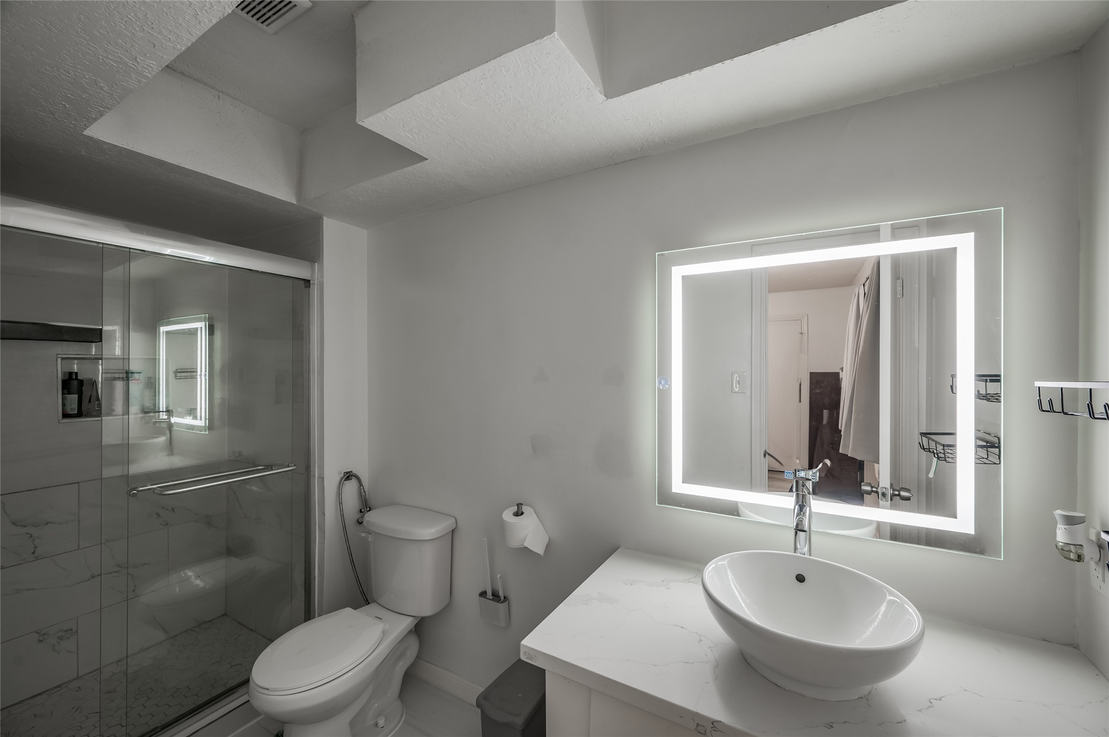 611 Montclair Boulevard Sugar Land, TX 77478 - Photo 45 of 50 This 3rd bath, featuring a sleek glass shower, adds a touch of luxury to your daily routine. The clean, modern design makes it a standout feature, combining practicality with high-end design.