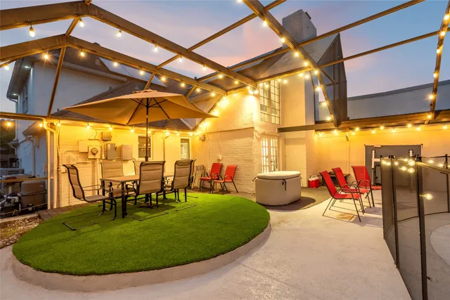 a view of a swimming pool with a patio