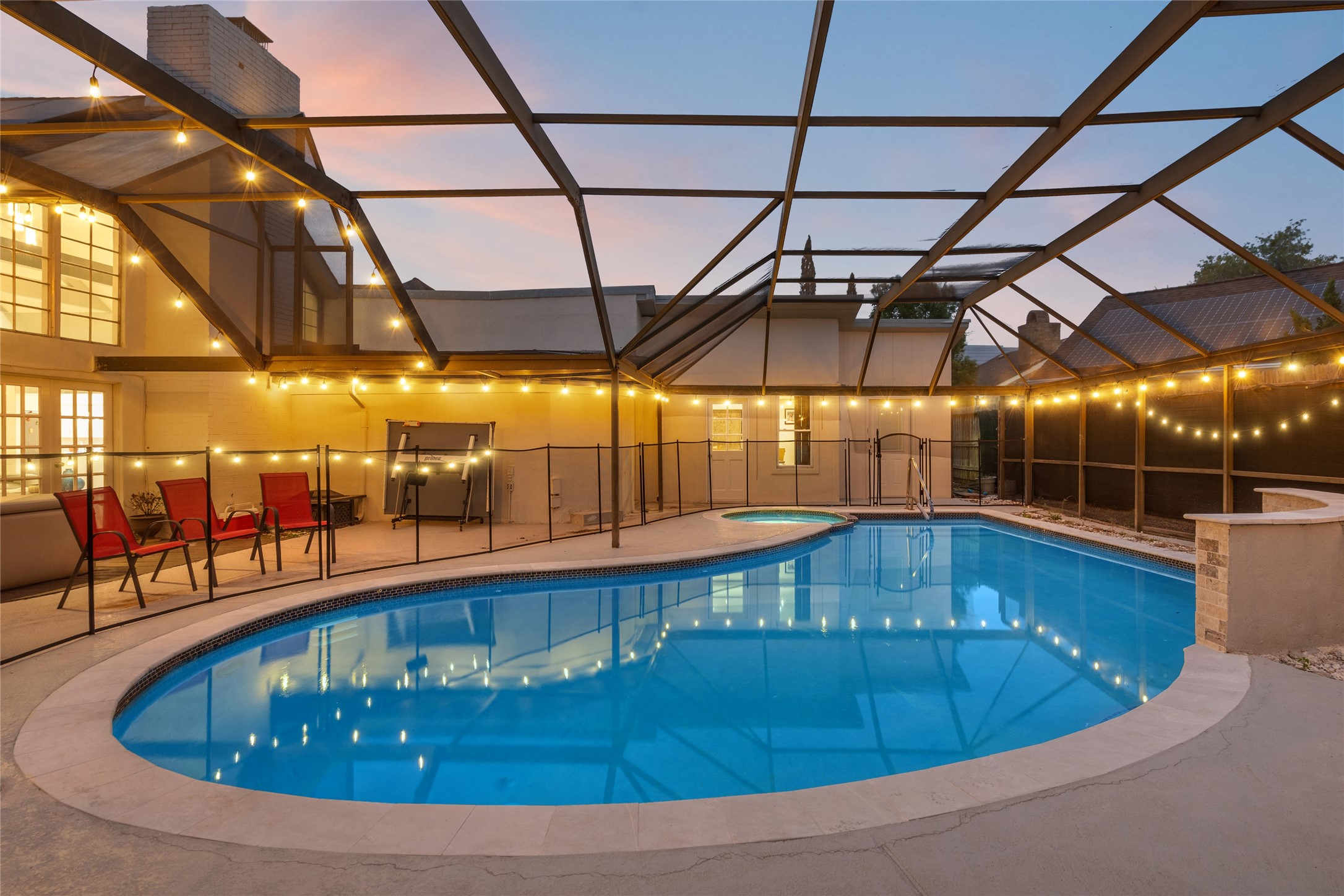 611 Montclair Boulevard Sugar Land, TX 77478 - Photo 7 of 50 Enjoy the tranquil ambiance of the pool, complete with ambient lighting for evening dips.