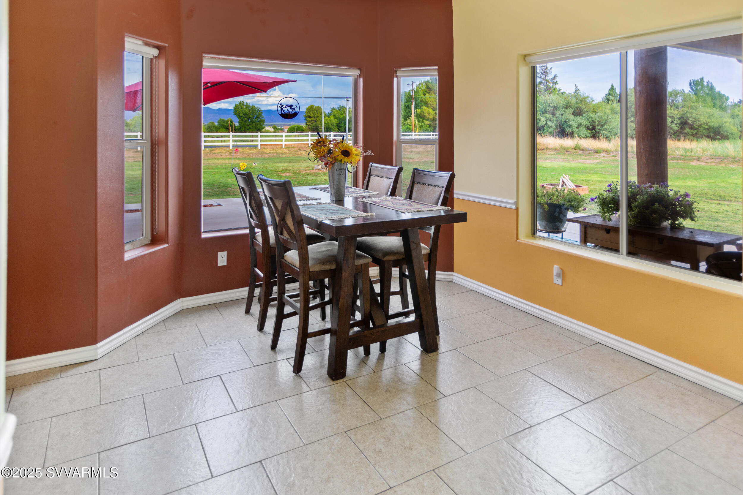 455 East Flint Knap Way Camp Verde, AZ 86322 - Photo 13 of 49 a dining room with furniture and a floor to ceiling window