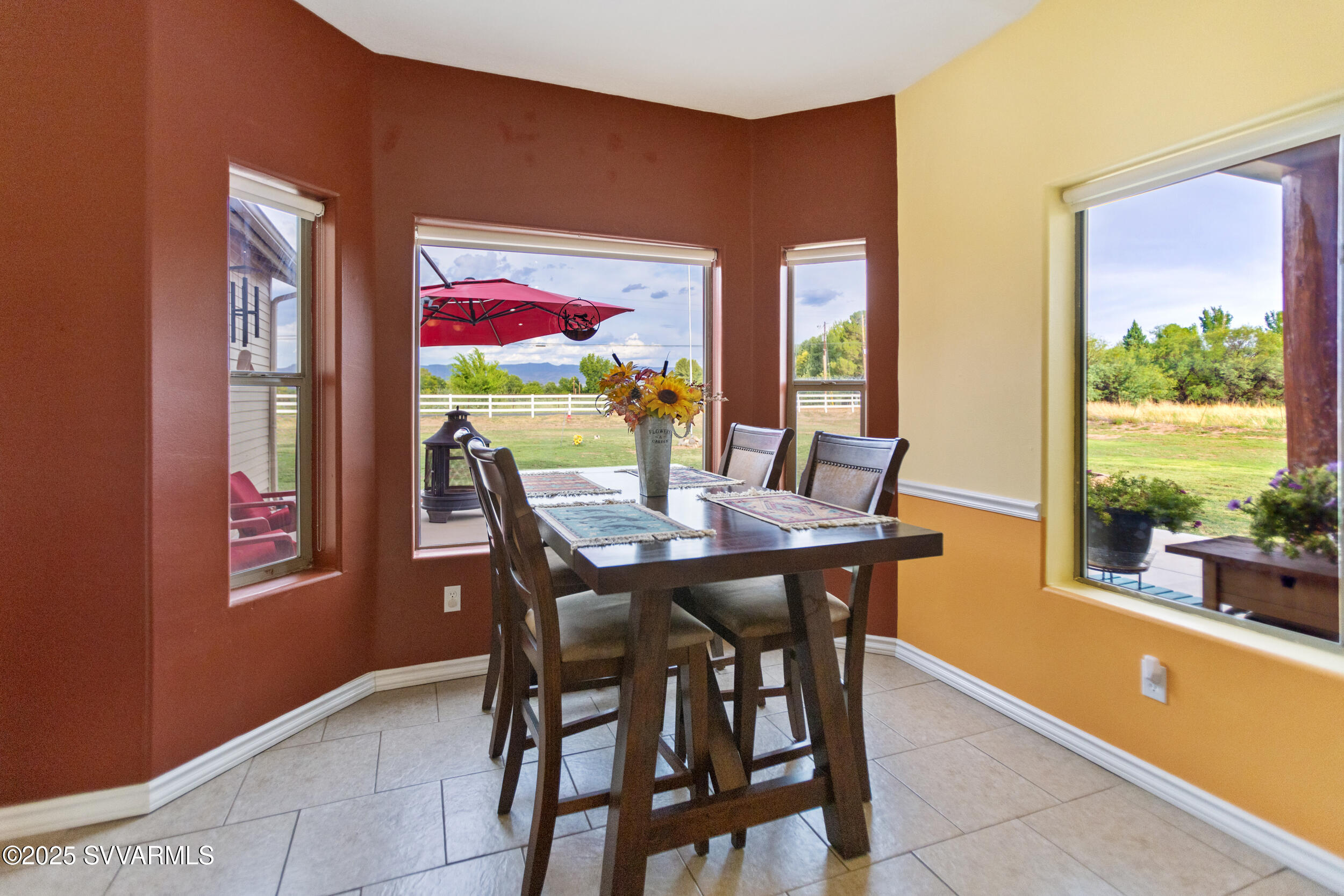 455 East Flint Knap Way Camp Verde, AZ 86322 - Photo 14 of 49 a view of a dining room with furniture a chandelier and wooden floor