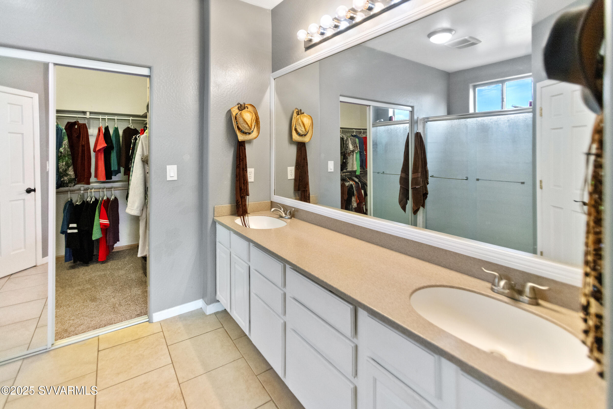 455 East Flint Knap Way Camp Verde, AZ 86322 - Photo 20 of 49 a bathroom with a double vanity sink and a mirror