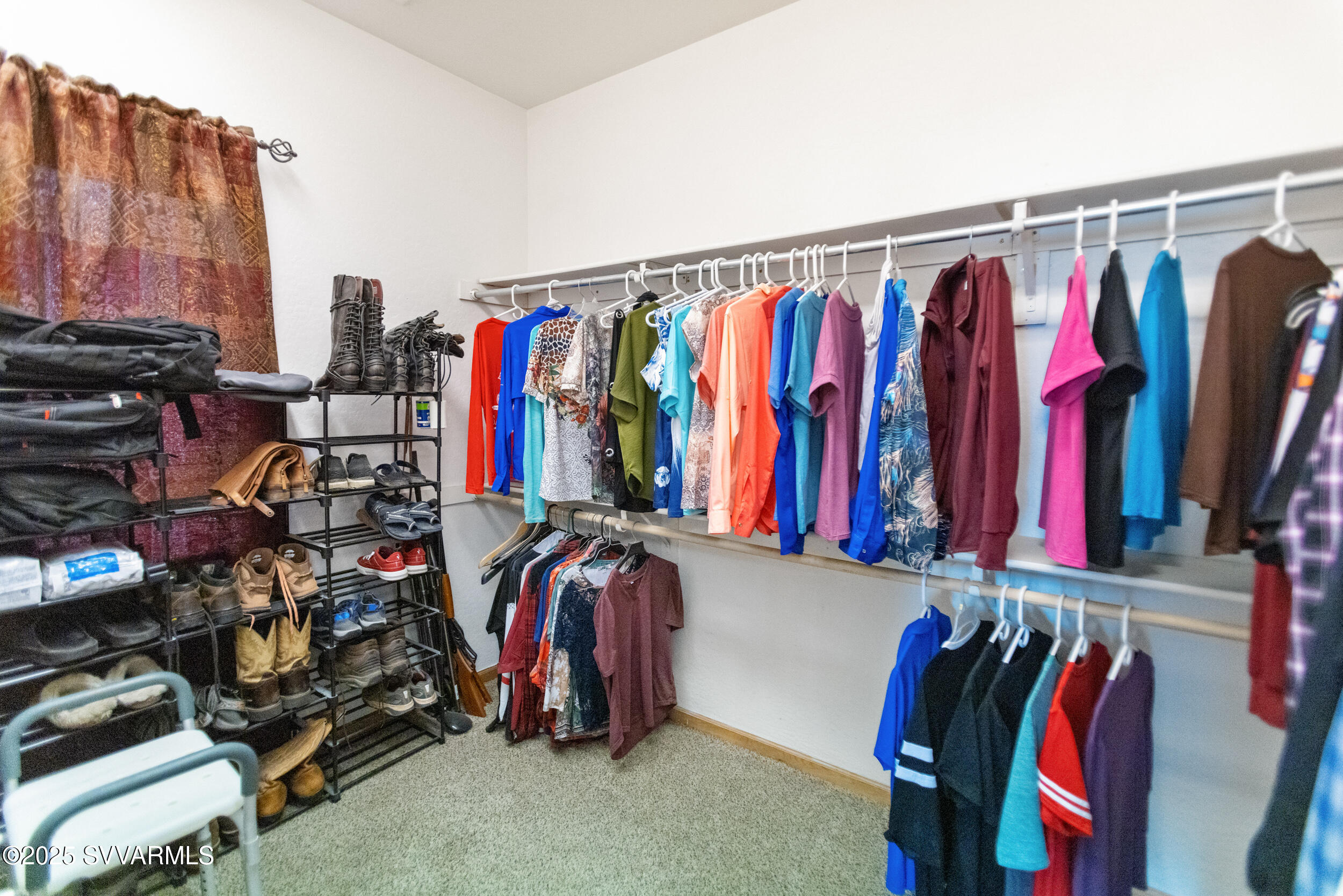 455 East Flint Knap Way Camp Verde, AZ 86322 - Photo 21 of 49 a view of walk in closet with clothes