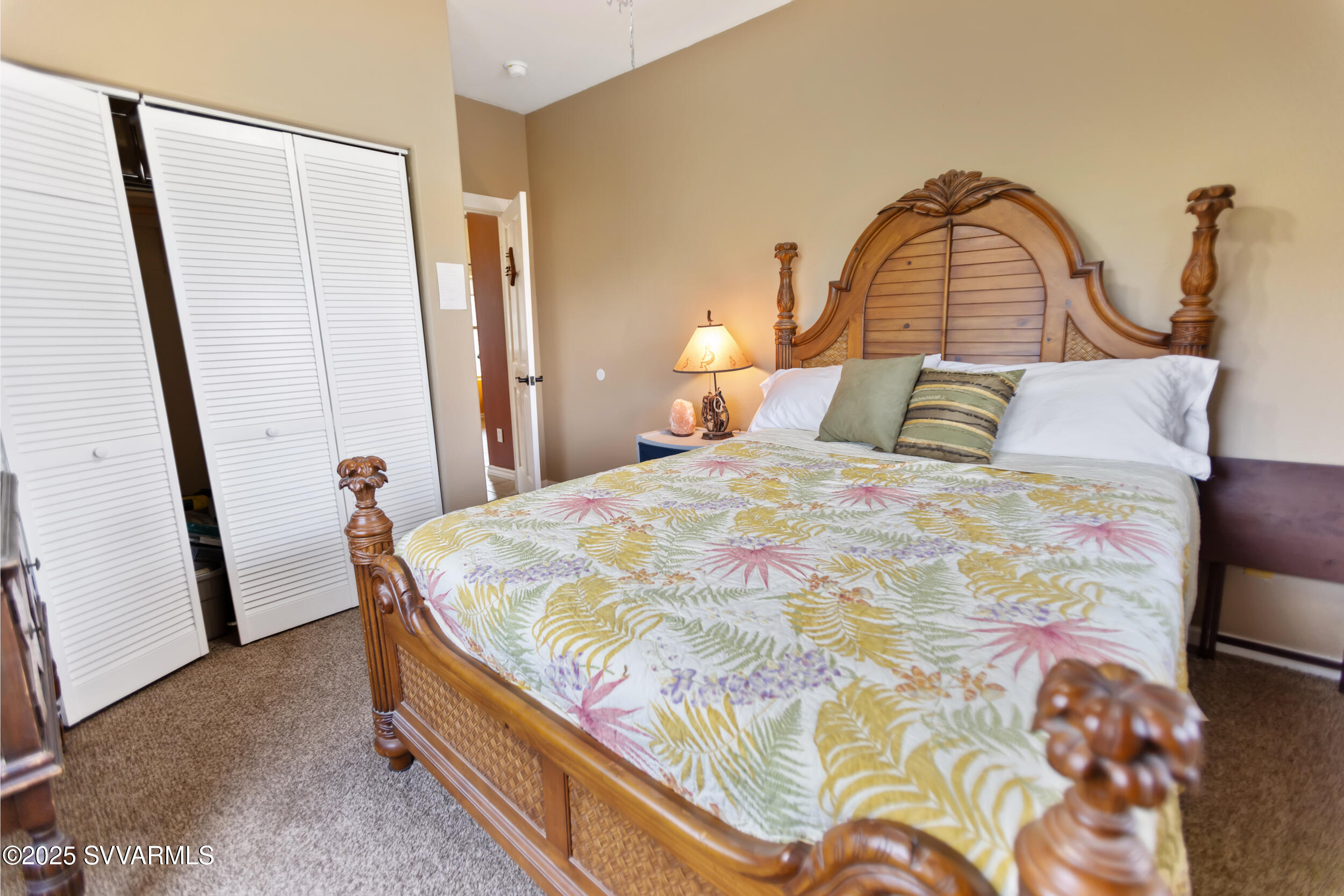 455 East Flint Knap Way Camp Verde, AZ 86322 - Photo 23 of 49 a bed sitting in a bedroom next to a window