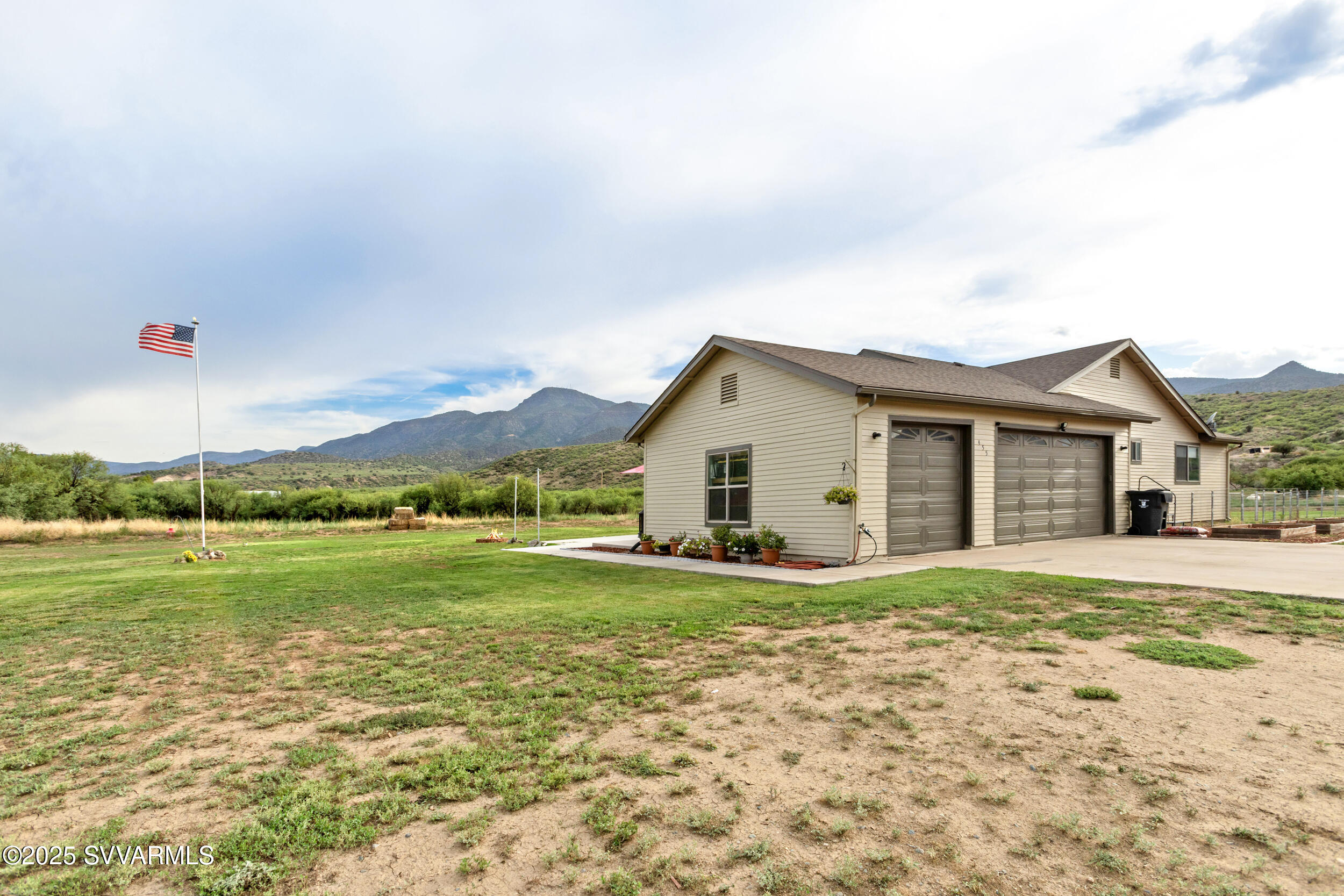 455 East Flint Knap Way Camp Verde, AZ 86322 - Photo 33 of 49 a view of a house with a big yard and a large tree