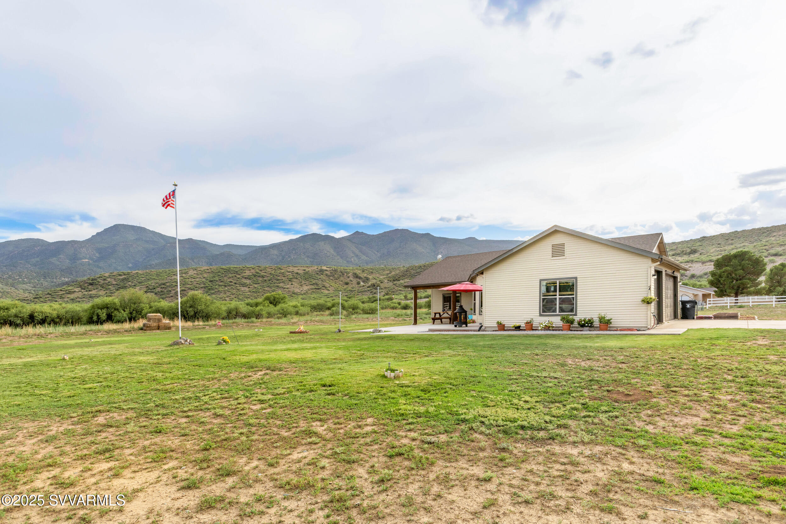 455 East Flint Knap Way Camp Verde, AZ 86322 - Photo 43 of 49 a view of a house with a big yard and potted plants