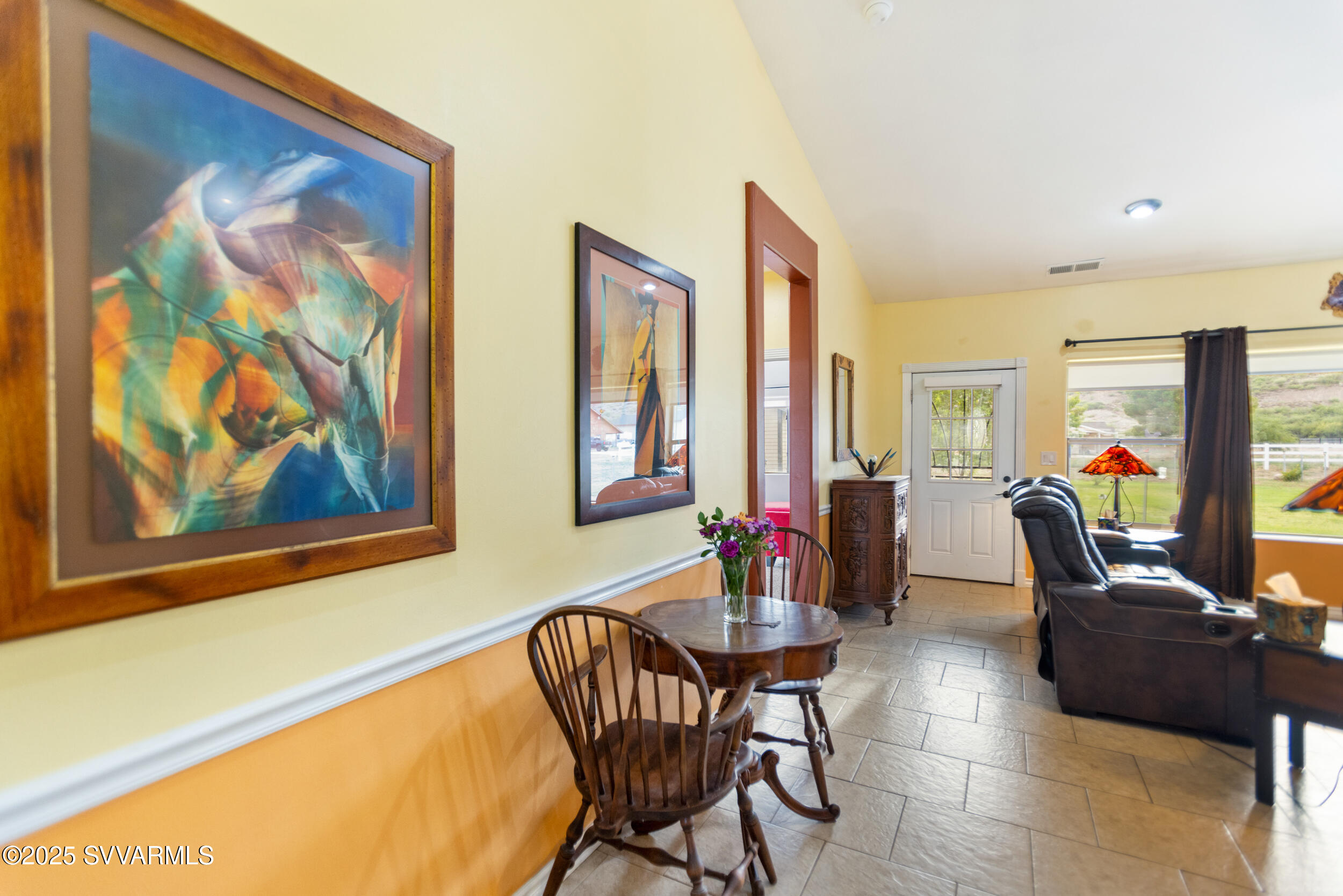 455 East Flint Knap Way Camp Verde, AZ 86322 - Photo 5 of 49 a view of a dining room with furniture window and wooden floor