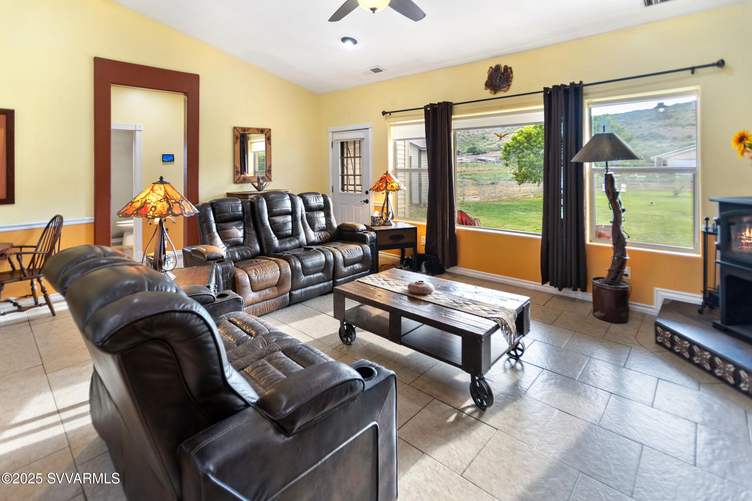 455 East Flint Knap Way Camp Verde, AZ 86322 - Photo 8 of 49 a living room with furniture and a floor to ceiling window