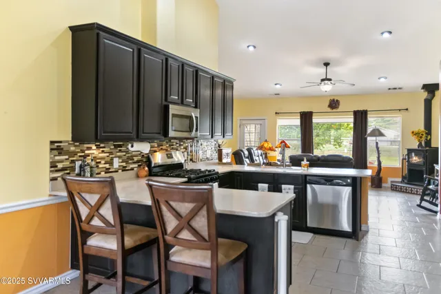 a kitchen with a table and chairs in it