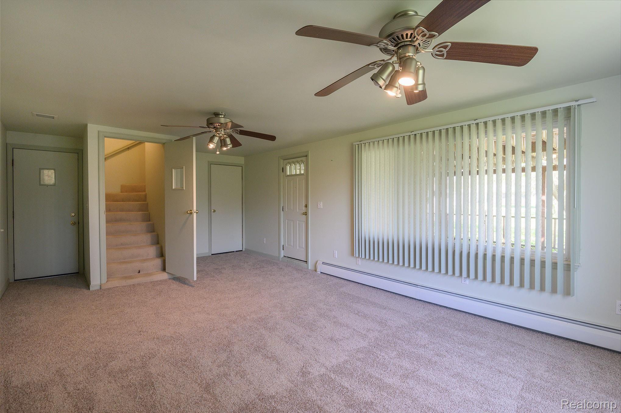 2087 Roland Avenue Flint, MI 48532 - Photo 11 of 22 Family room with storage. Access to upstairs and garage.