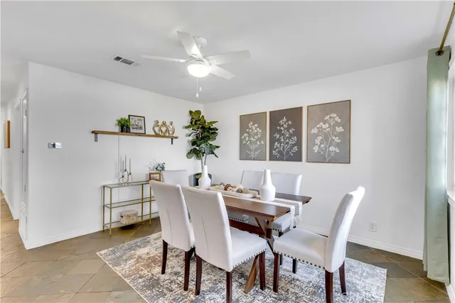 a view of a dining room with furniture