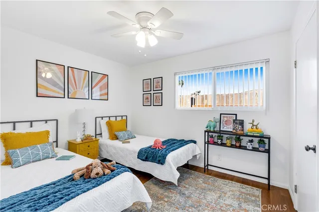 a living room with furniture and painting on the wall