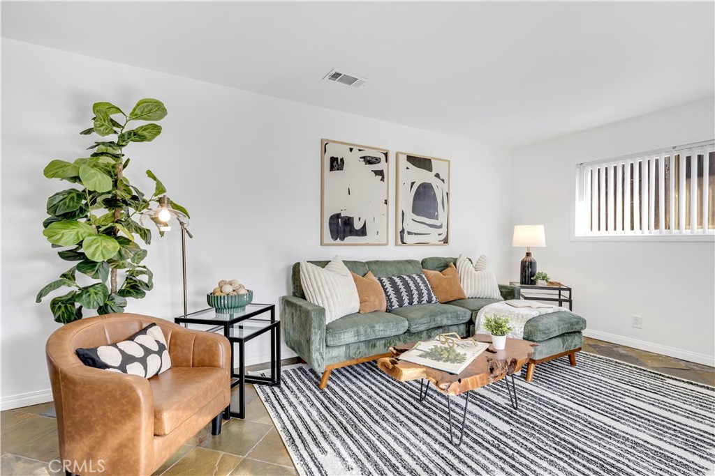 209 Madison Street Oceanside, CA 92057 - Photo 23 of 28 a living room with furniture and a rug