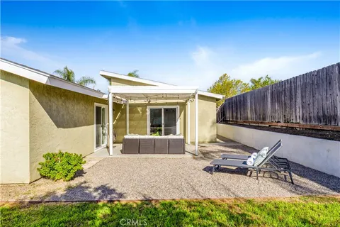 a house view with a sitting space and garden space