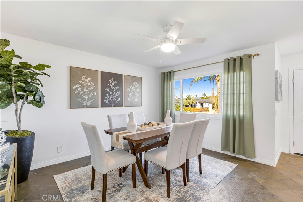 209 Madison Street Oceanside, CA 92057 - Photo 5 of 28 a dining room with furniture potted plants and wooden floor