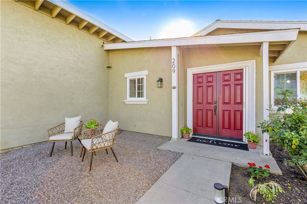 209 Madison Street Oceanside, CA 92057 - Photo 8 of 28 a view of backyard with a table and chairs and potted plants
