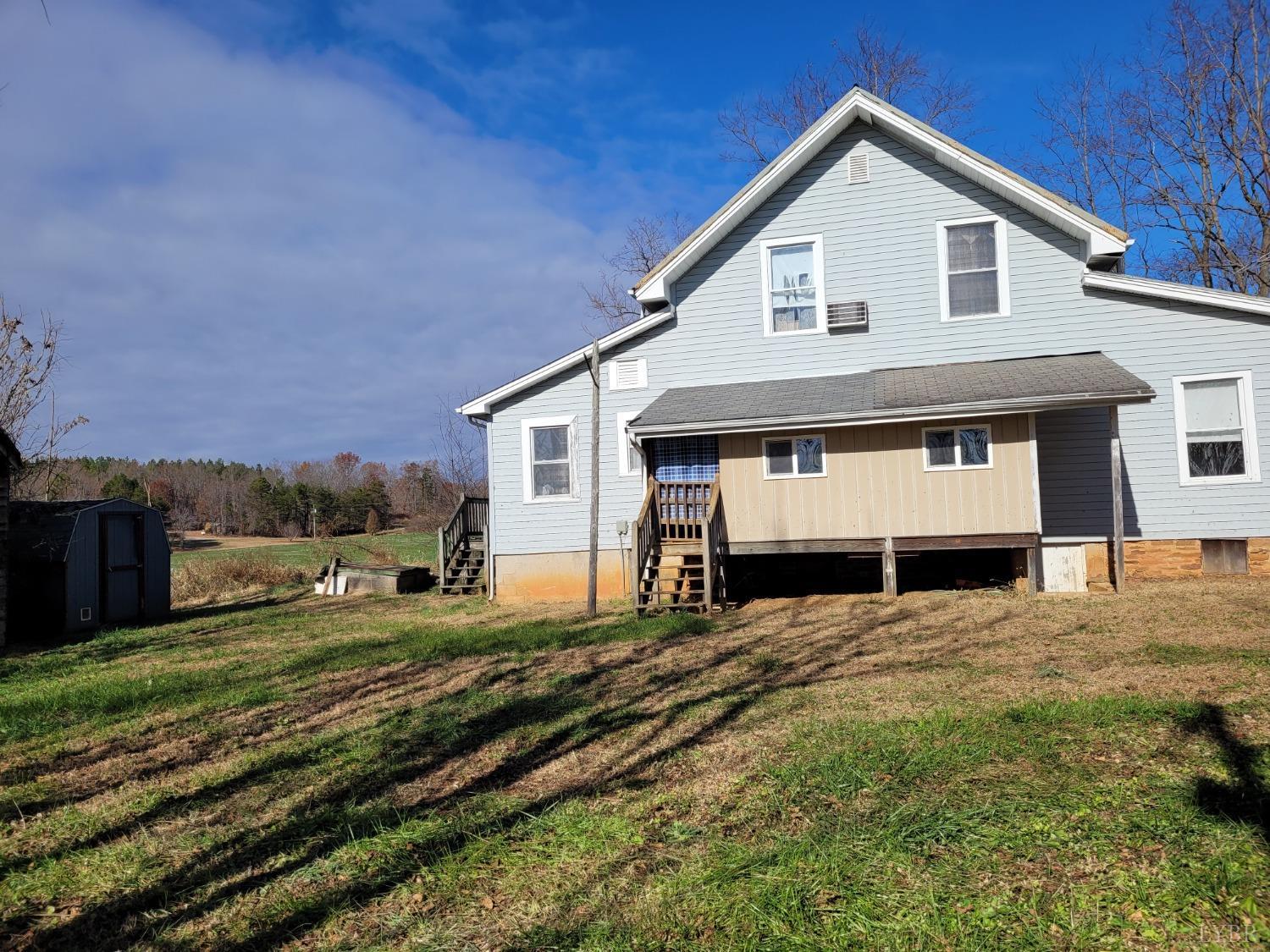 989 Red Oak School Road Rustburg, VA 24588 - Photo 23 of 26 a view of a house with a yard