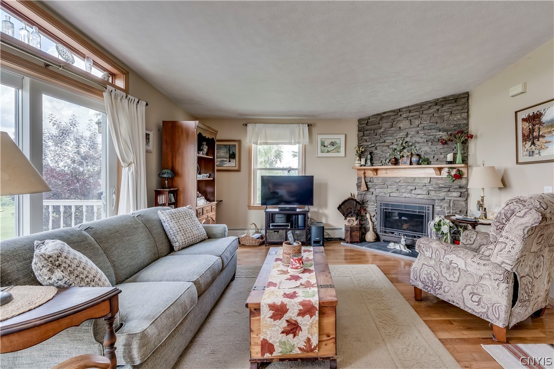 41561 Kehoe Tract Road Clayton, NY 13624 - Photo 12 of 49 Living room w/propane fireplace
