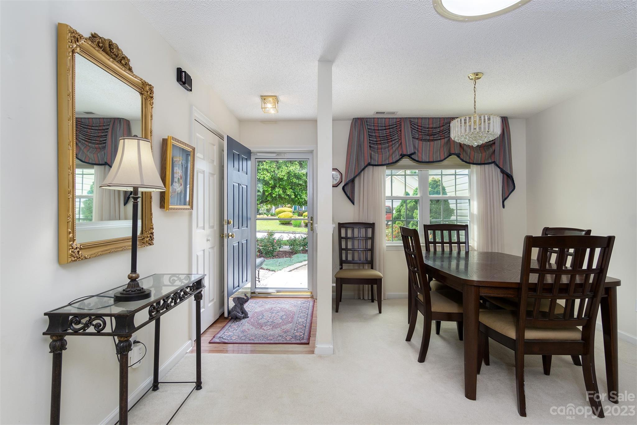 19 Briarbrook Road Fletcher, NC 28732 - Photo 14 of 46 a view of a dining room with furniture and a window