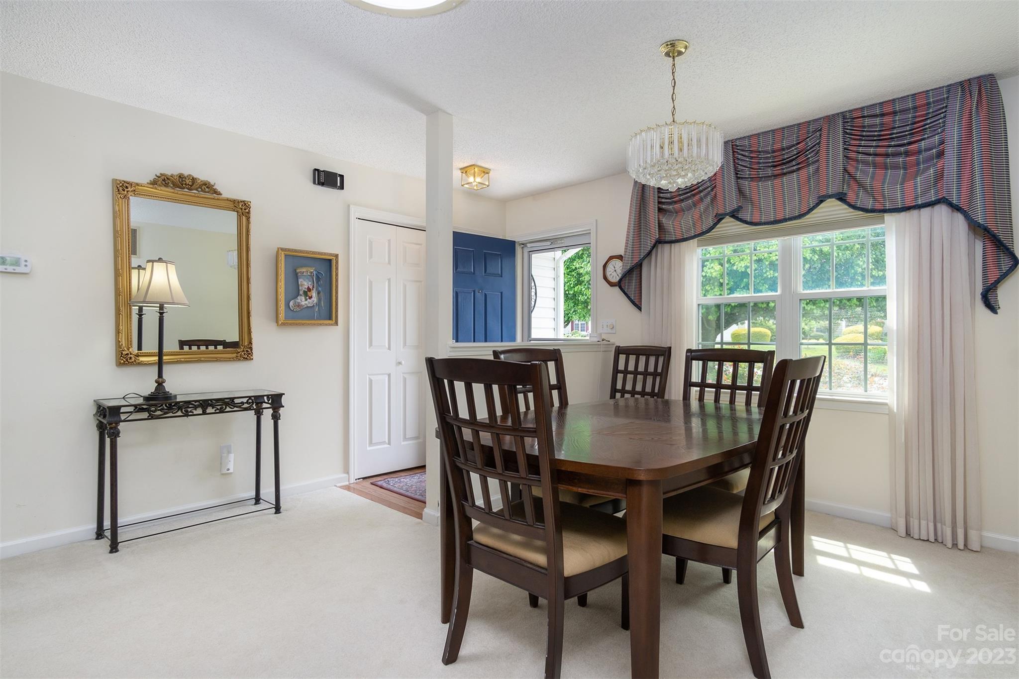 19 Briarbrook Road Fletcher, NC 28732 - Photo 15 of 46 a view of a dining room with furniture window and outside view