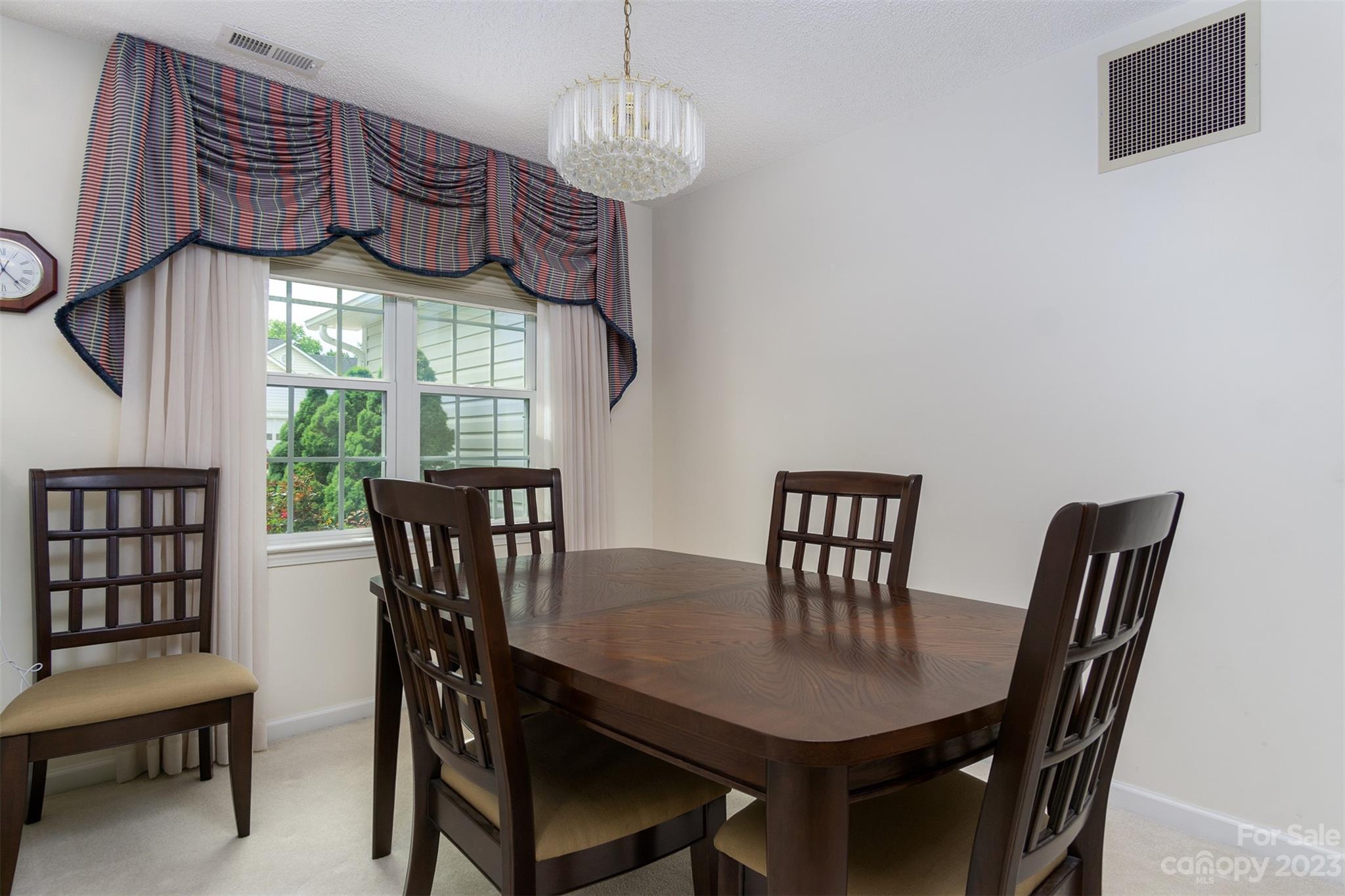 19 Briarbrook Road Fletcher, NC 28732 - Photo 16 of 46 a view of a dining room with furniture window and wooden floor