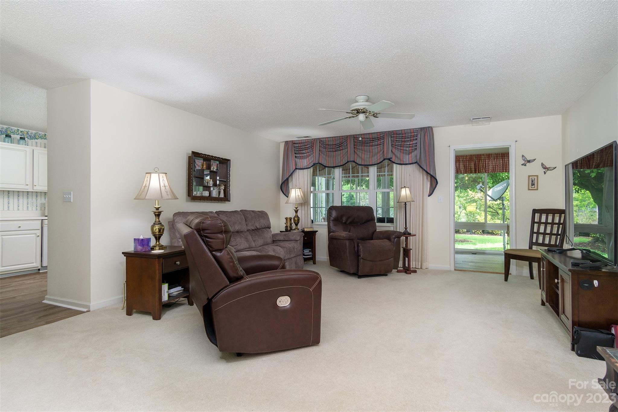 19 Briarbrook Road Fletcher, NC 28732 - Photo 18 of 46 a living room with furniture and a chandelier