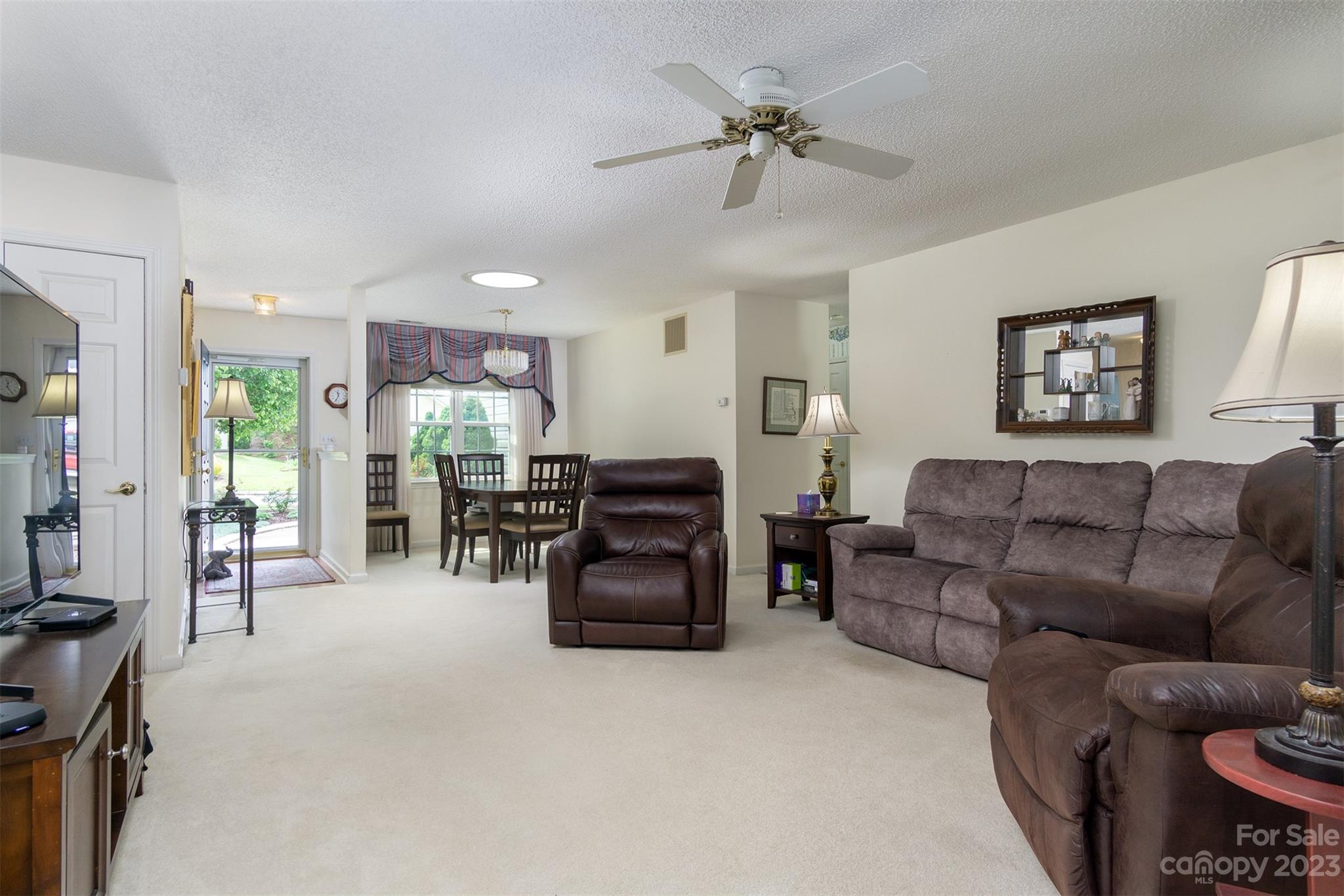 19 Briarbrook Road Fletcher, NC 28732 - Photo 19 of 46 a living room with furniture and a flat screen tv