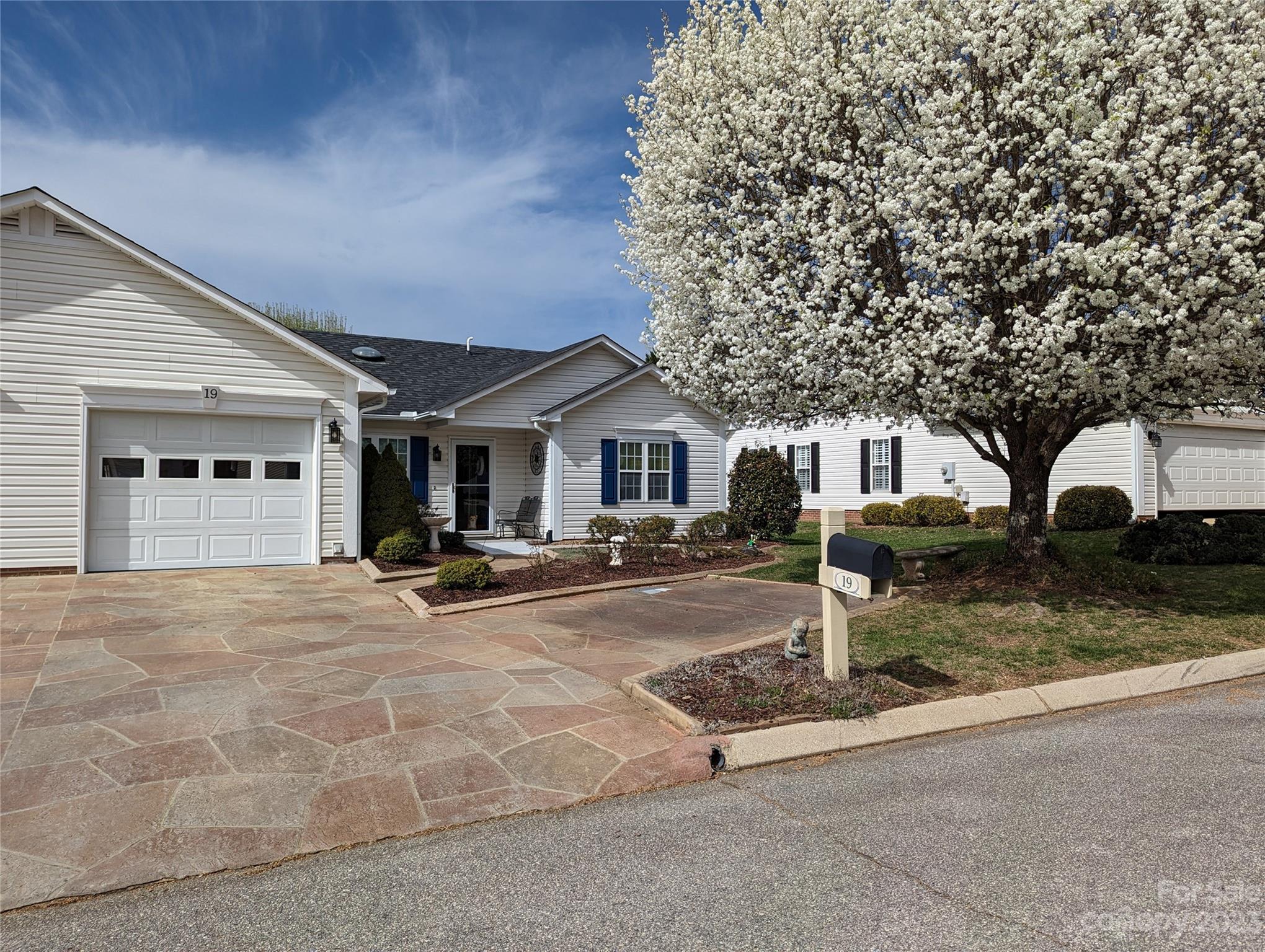 19 Briarbrook Road Fletcher, NC 28732 - Photo 2 of 46 front view of a house with yard and garage
