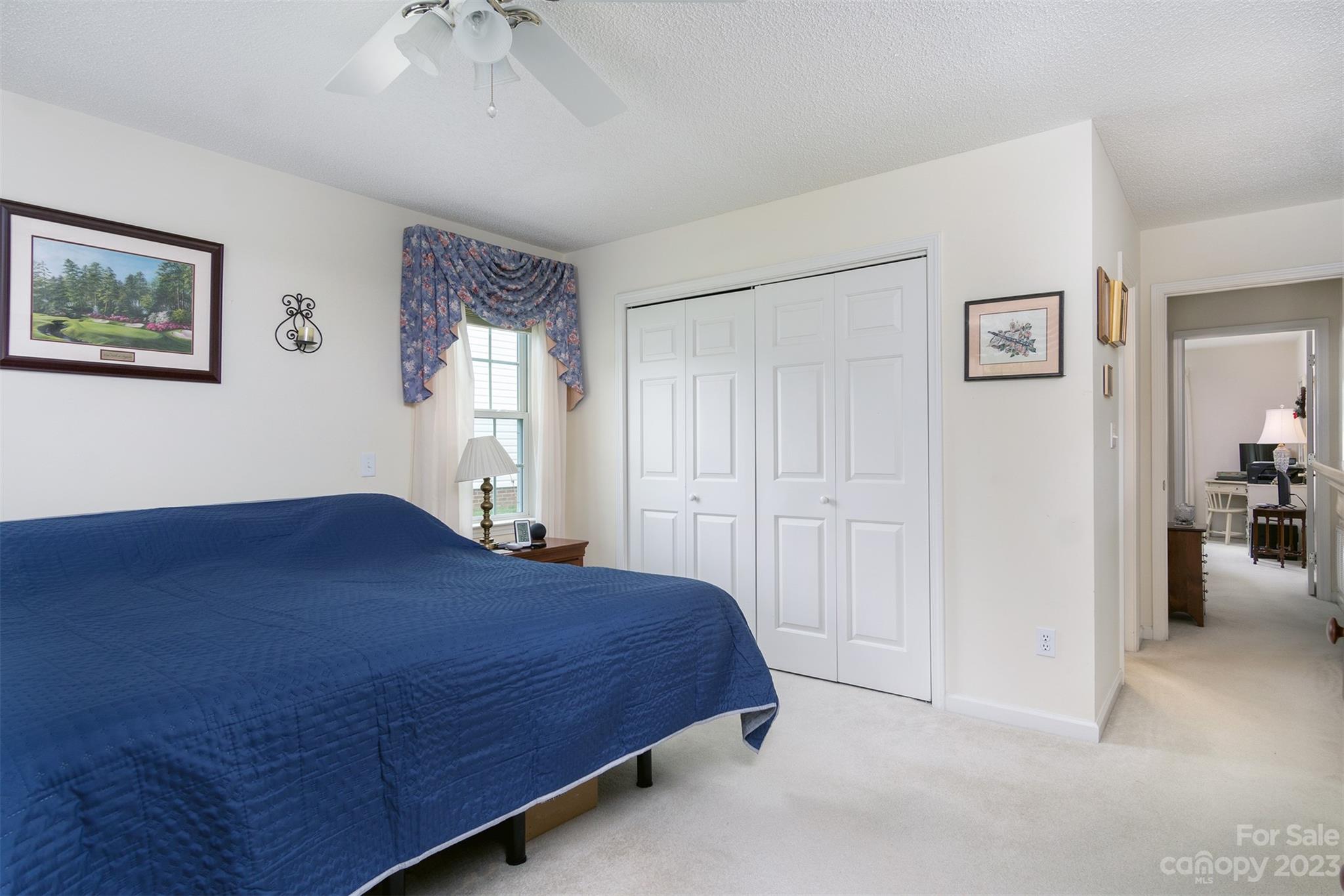 19 Briarbrook Road Fletcher, NC 28732 - Photo 22 of 46 a bedroom with a bed and a chandelier