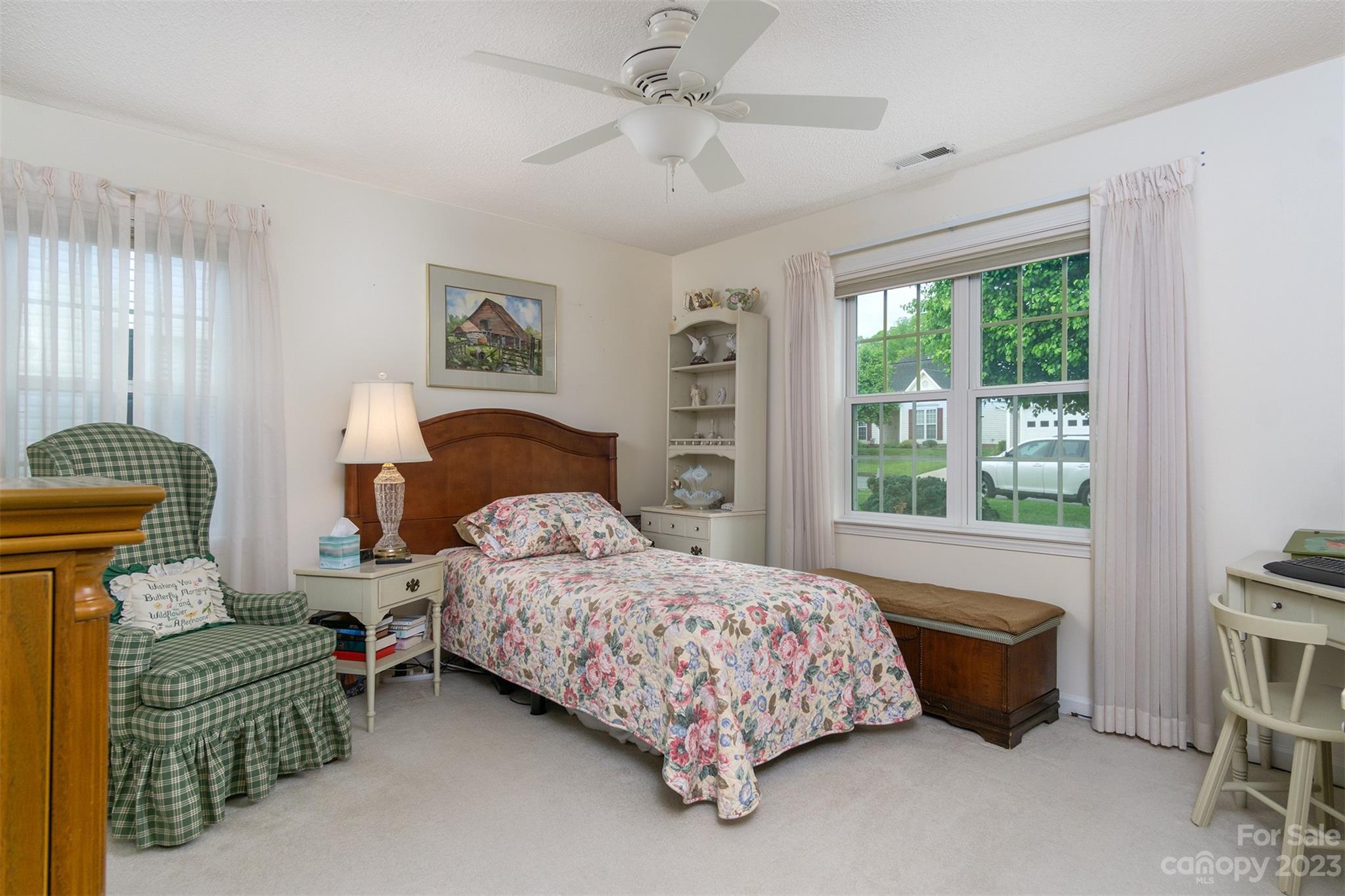 19 Briarbrook Road Fletcher, NC 28732 - Photo 24 of 46 a bedroom with a bed and a dresser with windows