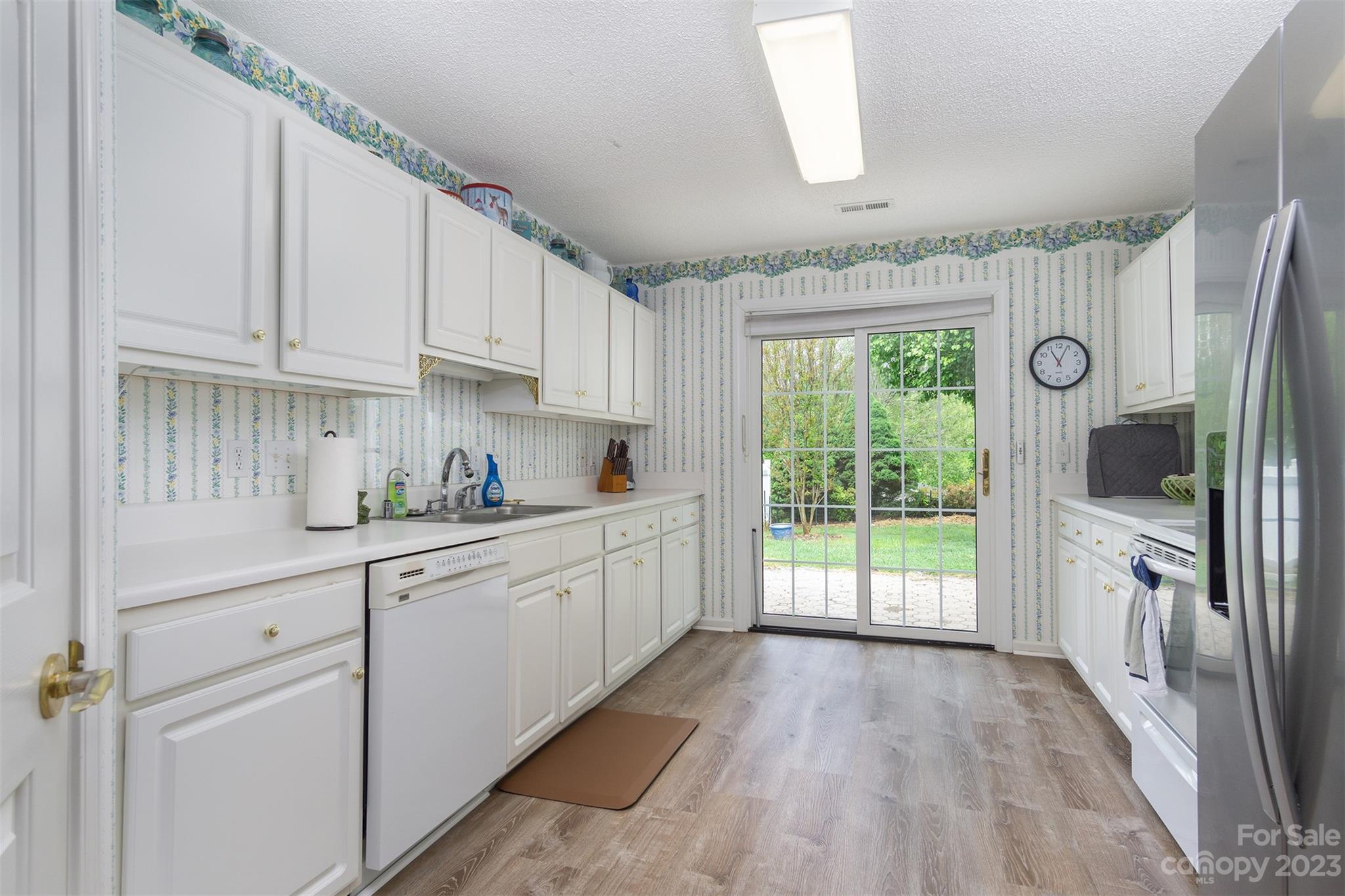 19 Briarbrook Road Fletcher, NC 28732 - Photo 27 of 46 a kitchen with granite countertop white cabinets and white appliances