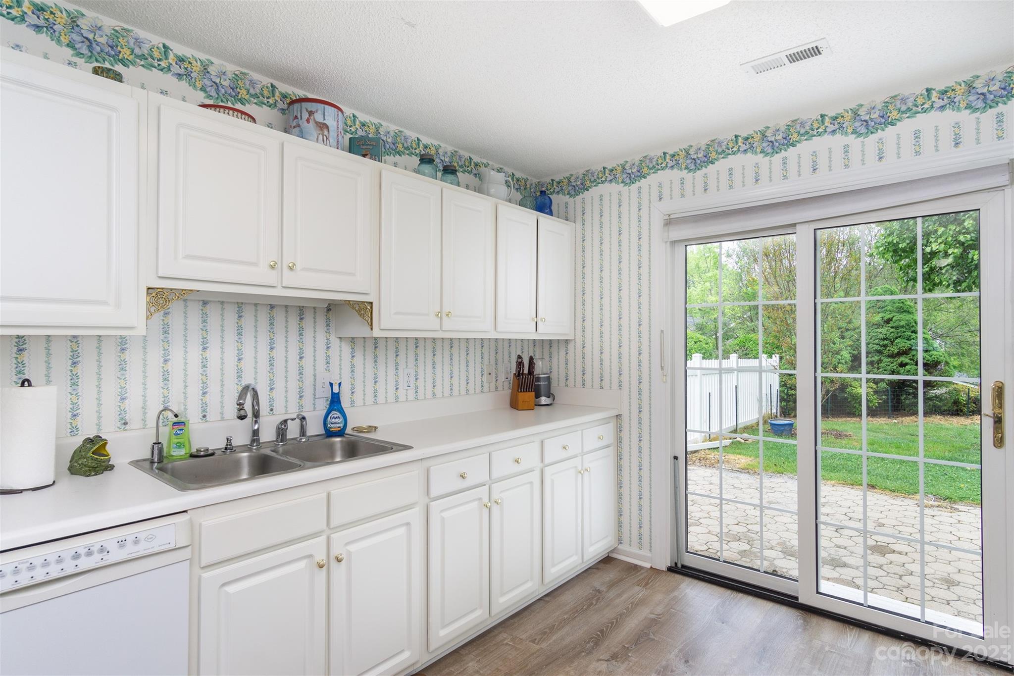 19 Briarbrook Road Fletcher, NC 28732 - Photo 29 of 46 a kitchen with stainless steel appliances white cabinets and a window