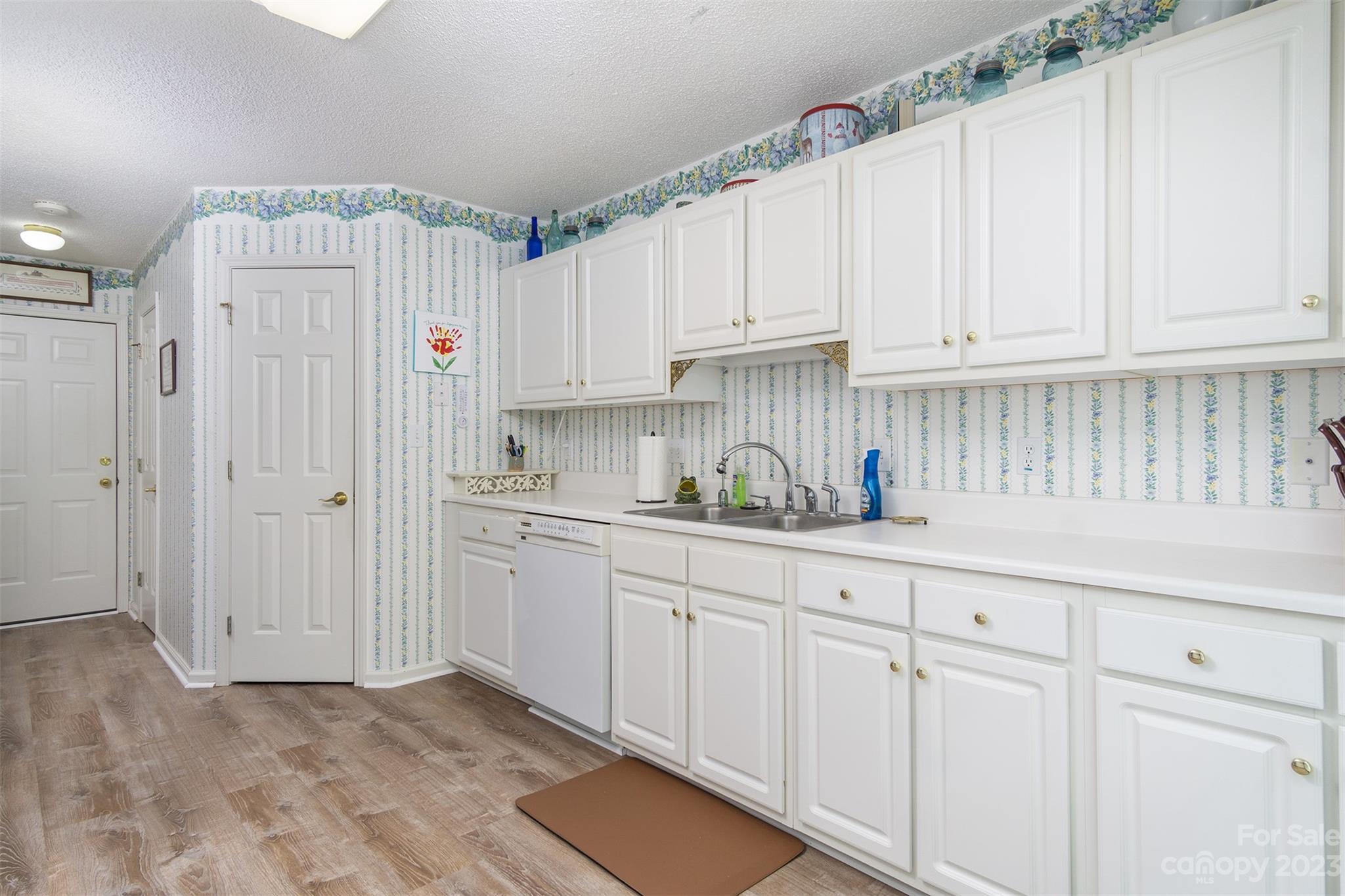 19 Briarbrook Road Fletcher, NC 28732 - Photo 30 of 46 a kitchen with white cabinets and white appliances